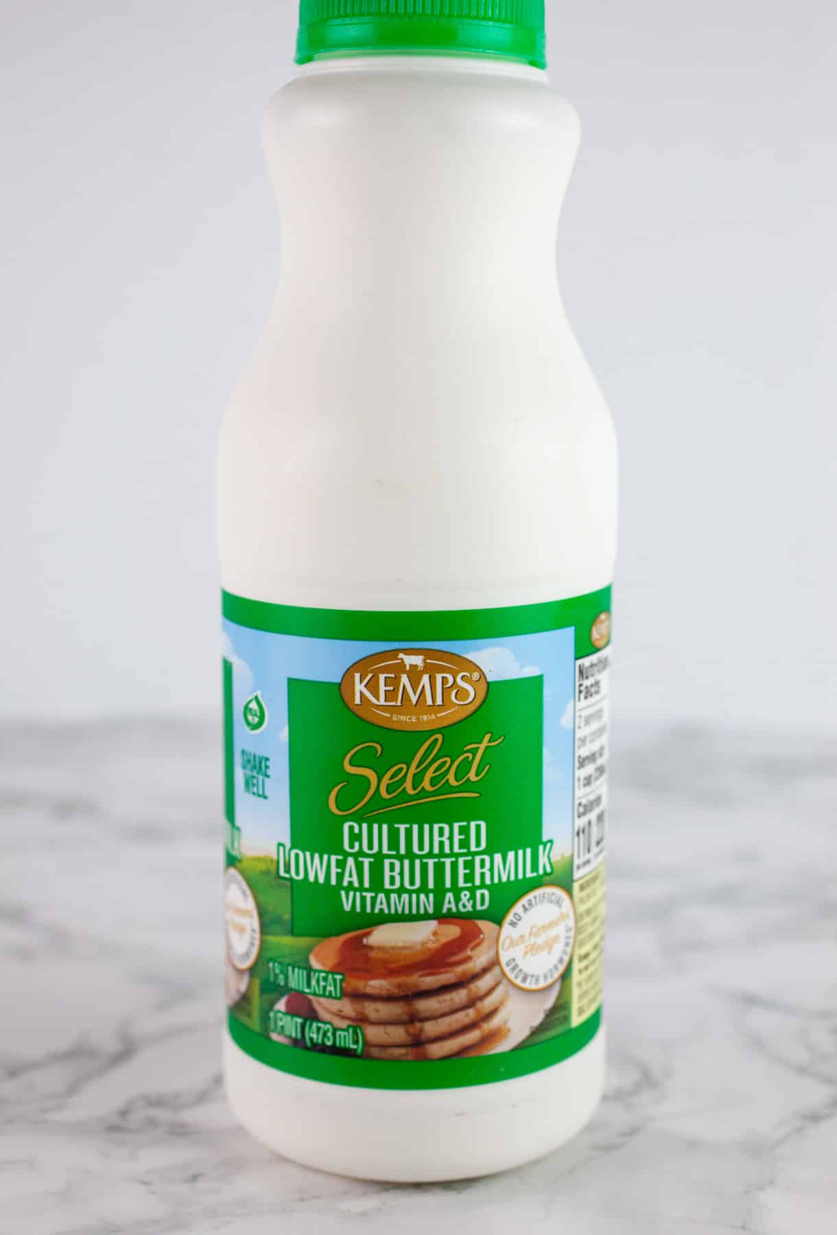 Unopened small jug of buttermilk.