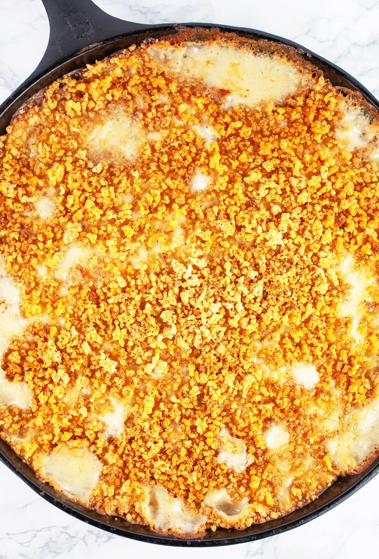 Baked kohlrabi gratin in cast iron skillet.