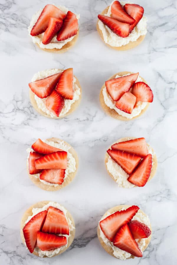 Puff pastry rounds topped with mascarpone cream and fresh strawberries.