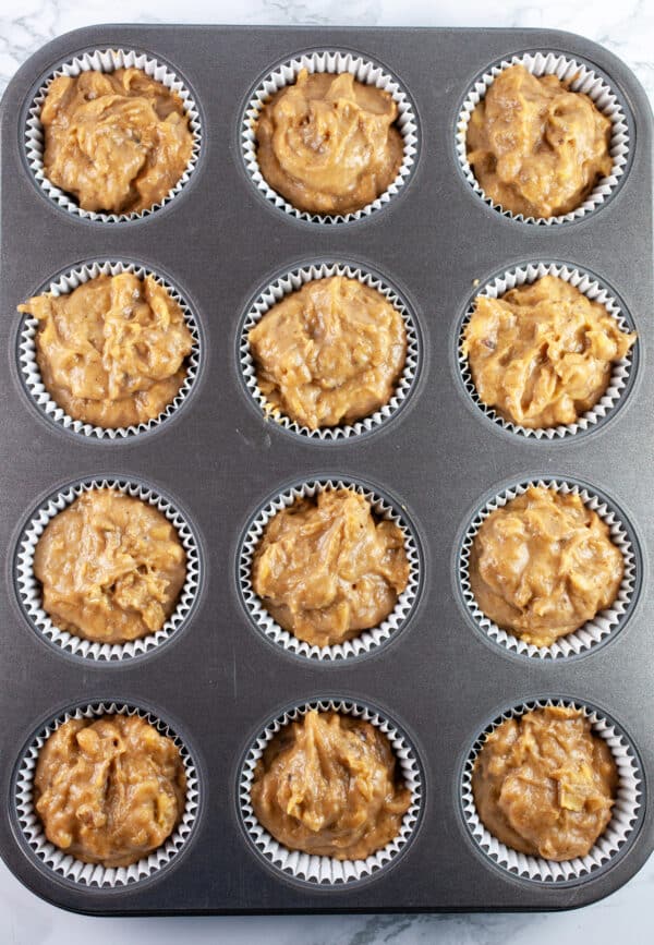 Banana walnut batter in muffin tin.
