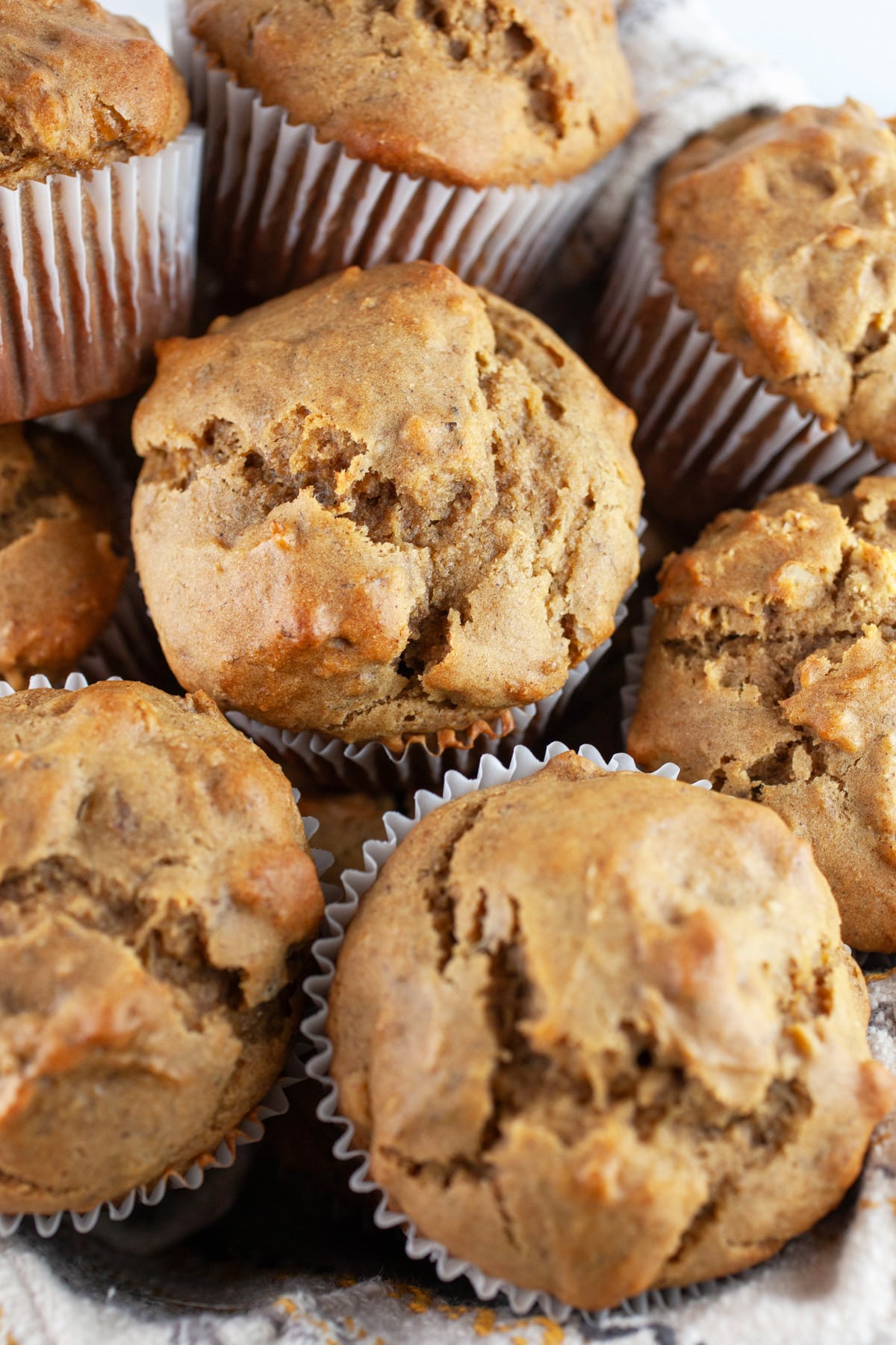 This is one of the all-time best banana muffin recipes. These Jumbo Roasted Banana Walnut Muffins are super moist and easy to make. The roasted banana really amps up the banana flavor. There is a touch of cinnamon in these banana nut muffins. These muffins will make you want to get up in the morning! Banana walnut muffins and a cup of coffee is the best breakfast ever! #ad @illy #illyinspires #bananamuffins #muffins #bananawalnut Roasted banana walnut muffins in bowl.