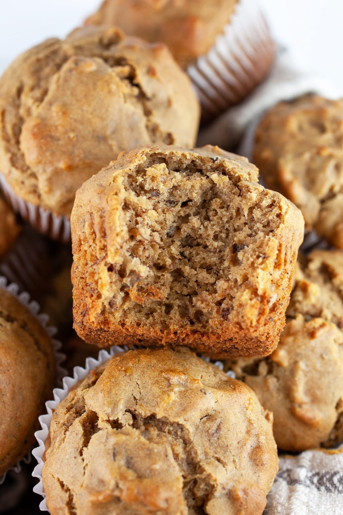 Bite taken from roasted banana walnut muffin.