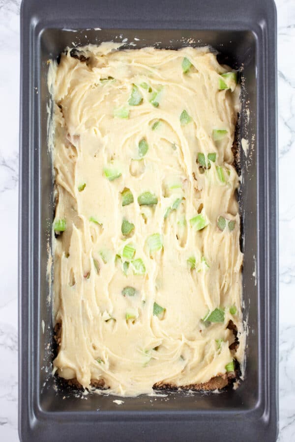 Uncooked rhubarb bread in metal bread pan.