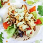 Roasted veggie tacos with cashew cilantro sauce.