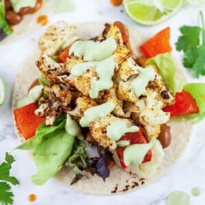 Roasted veggie tacos with cashew cilantro sauce.