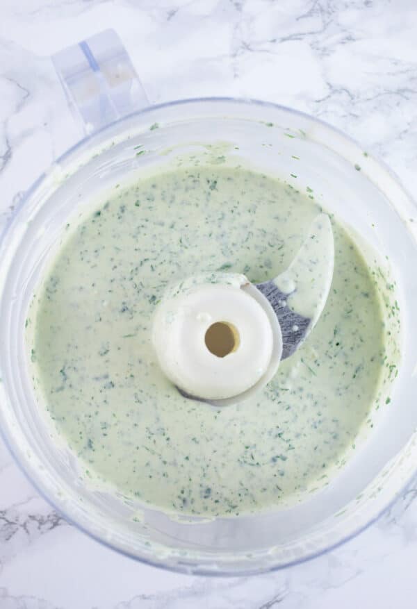 Creamy cilantro lime dressing in food processor.