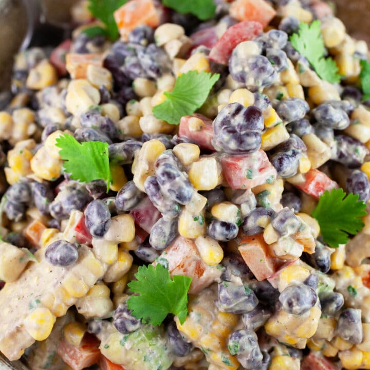 Black bean corn salad garnished with fresh cilantro.