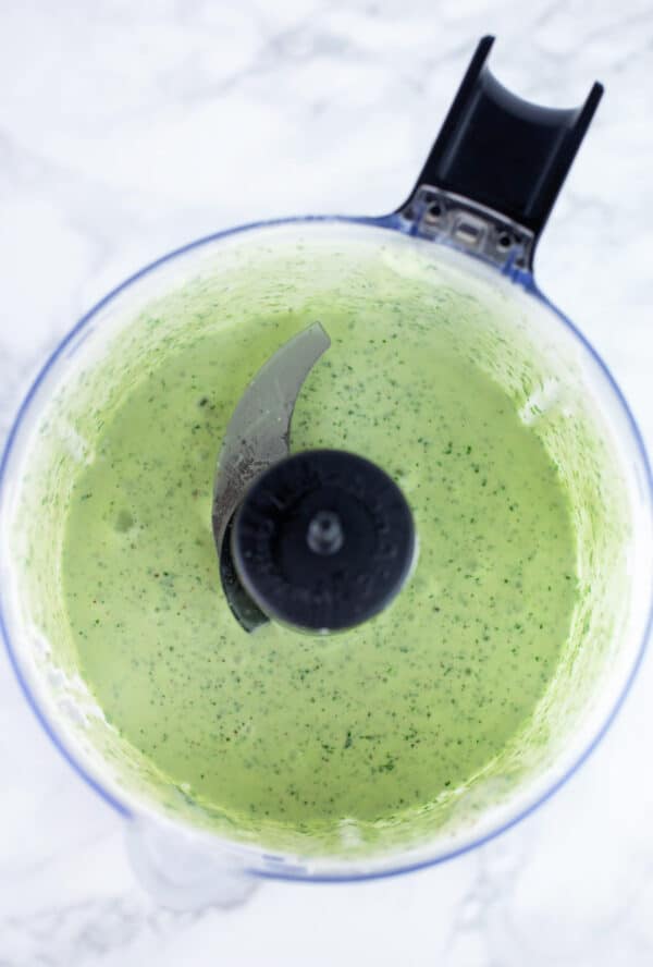 Creamy cilantro lime dressing in small food processor.