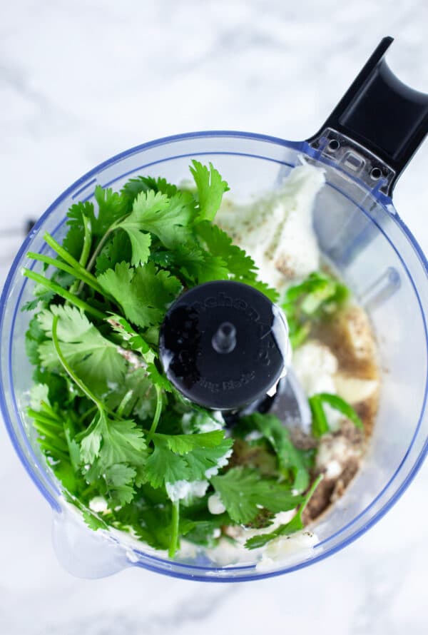Mayo, sour cream, garlic, jalapeno, lime juice, fresh cilantro, and salt and pepper in small food processor.