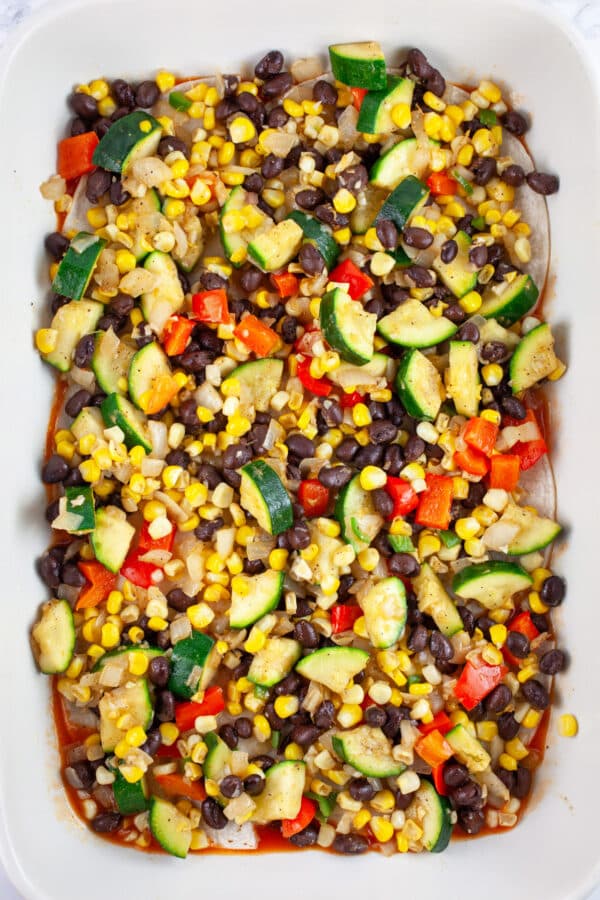 Sauteed vegetables in ceramic casserole dish.