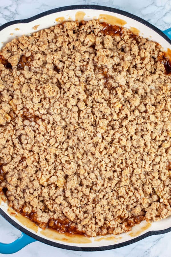 Baked apple crisp in cast iron skillet.