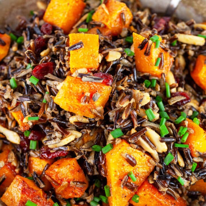 Wild rice butternut squash salad garnished with minced chives.