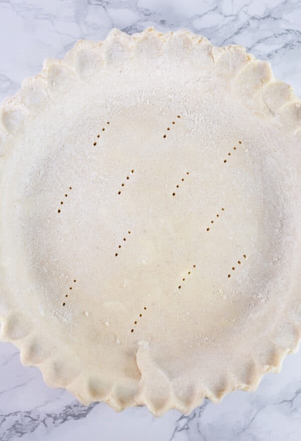 Unbaked gluten free pie crust in pie plate.