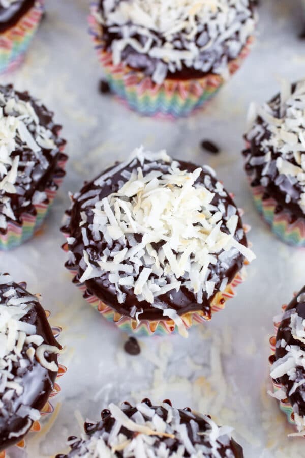 Chocolate chip cupcakes topped with chocolate ganache and toasted coconut.