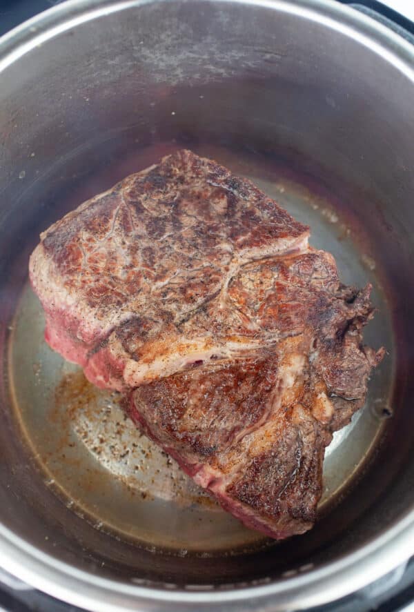 Seared beef chuck roast in Instant Pot.