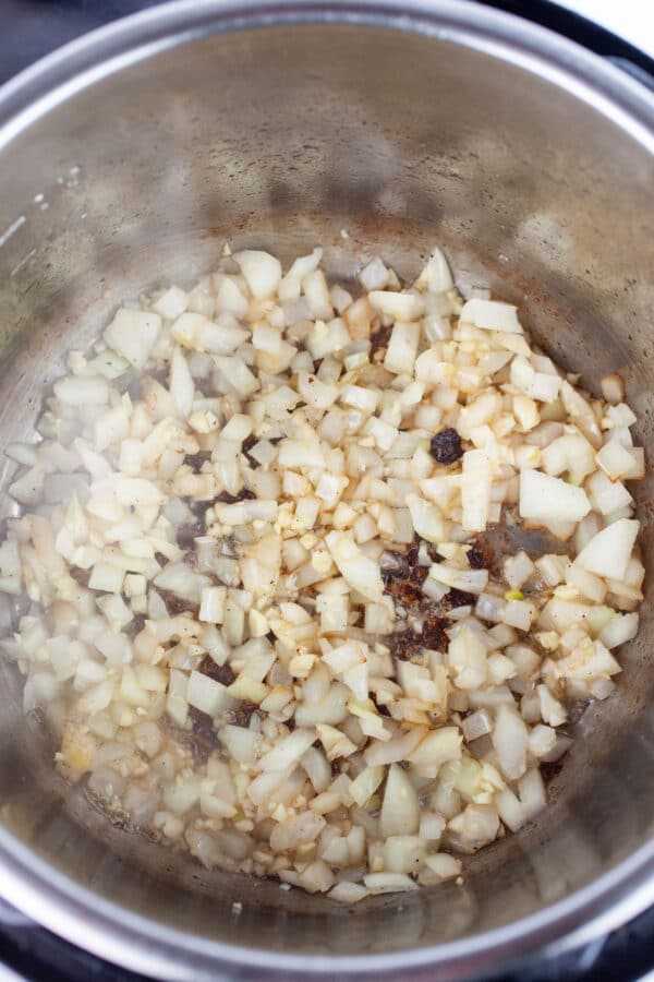 Minced garlic and onions sauteed in Instant Pot.