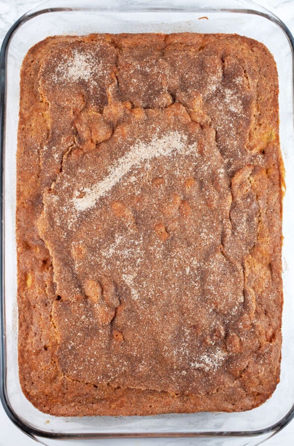 Baked rhubarb cake in glass baking dish.