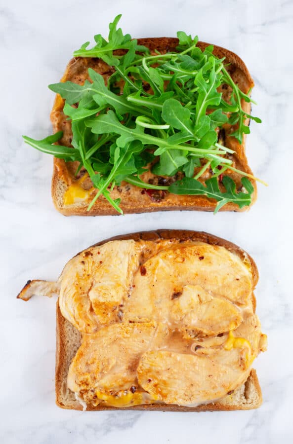 Chipotle chicken panini with fresh arugula.