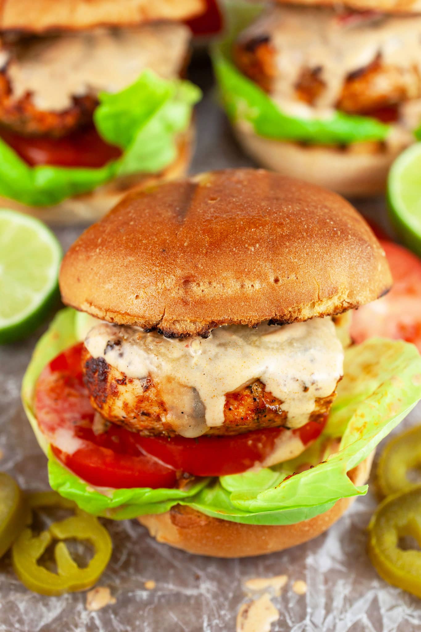 Southwest grilled chicken sandwiches with lettuce, tomatoes, and chipotle mayo.