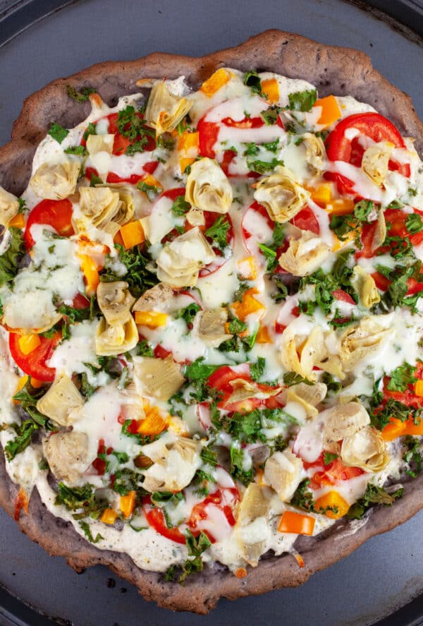 Baked Farmers Market Pizza on pizza pan.