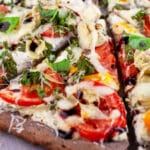 Sliced Farmers Market Pizza with balsamic glaze.