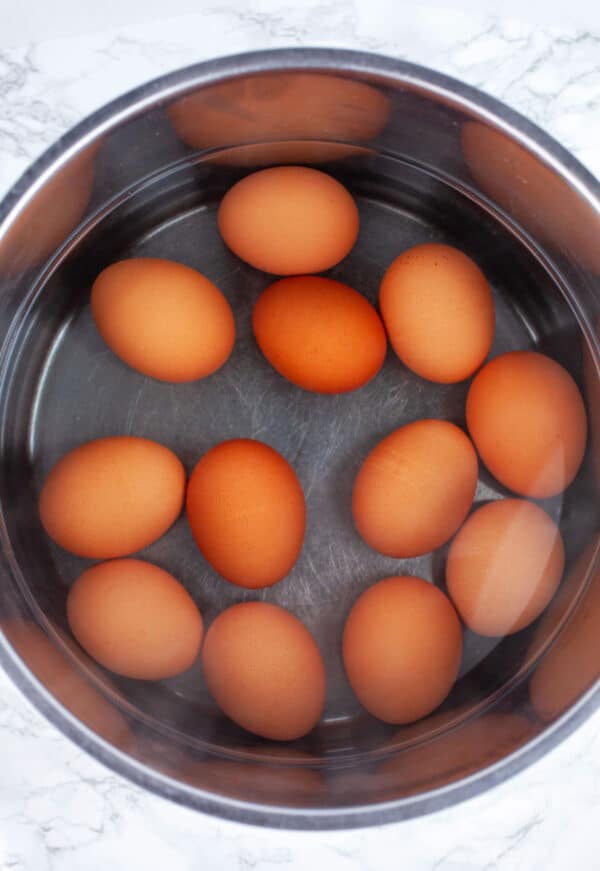 Hard boiled eggs in pot with water.