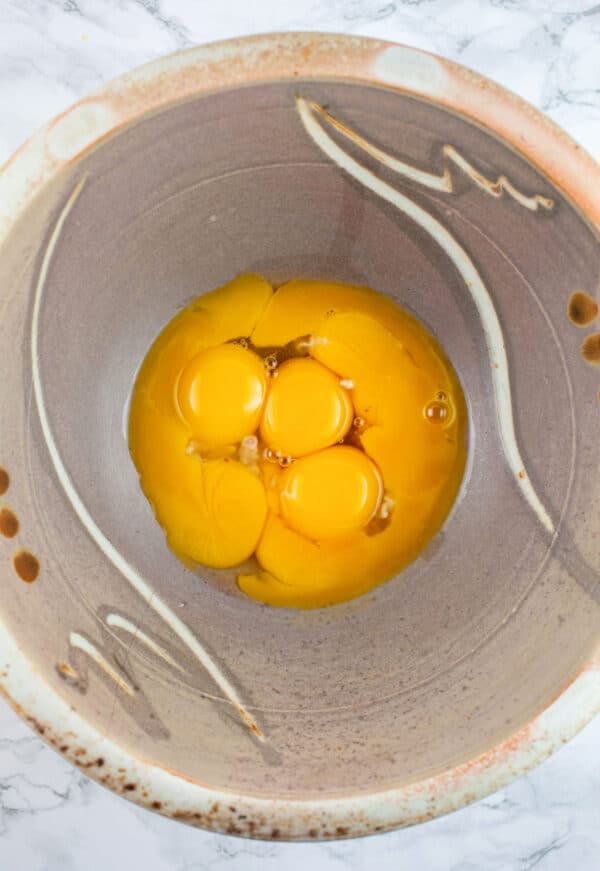 Egg yolks in ceramic bowl.